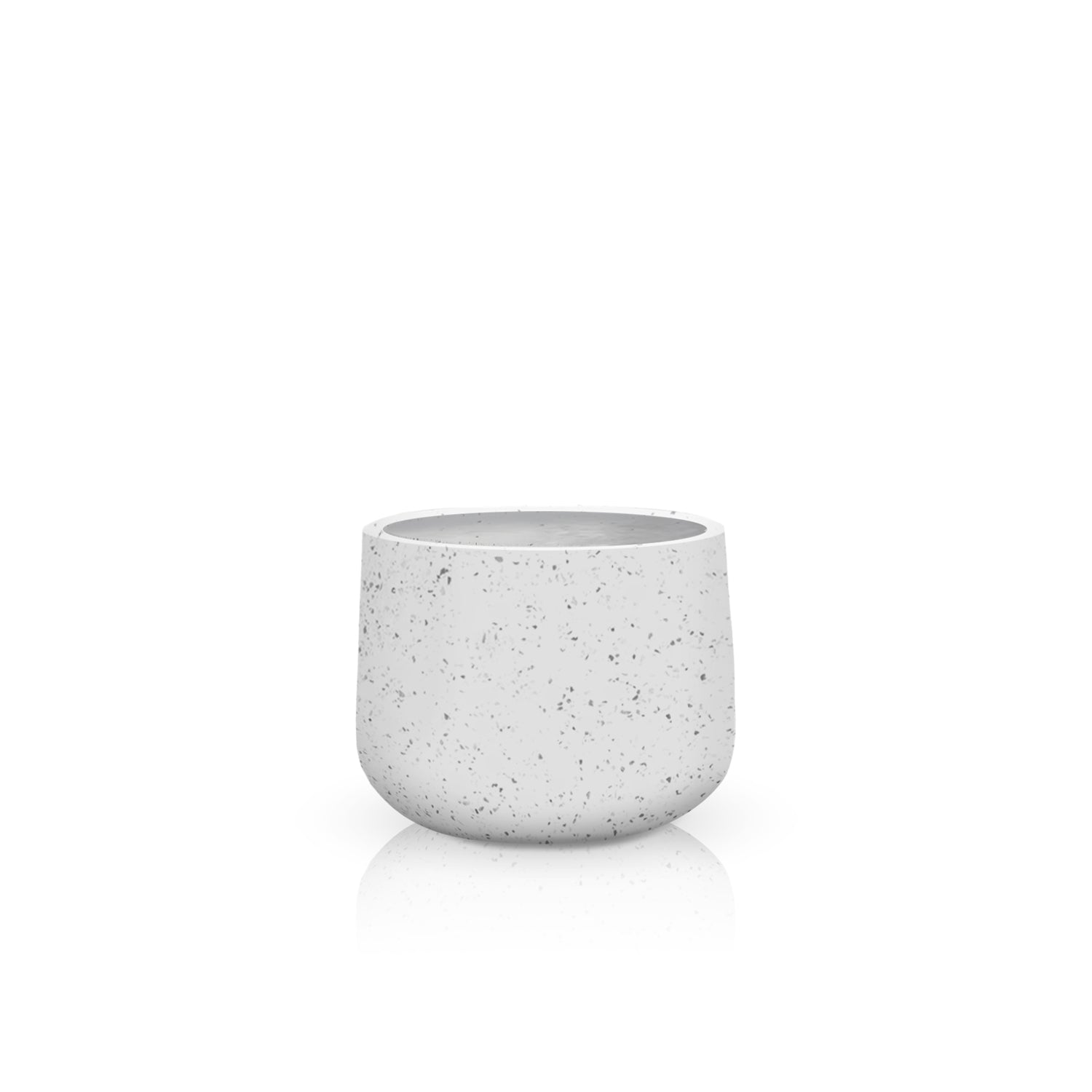 The Aura di Pietra Planter - Small by Landmark Decor is a handmade, speckled white ceramic pot with a smooth texture and minimalist design, ideal for small plants or decorations on reflective surfaces.
