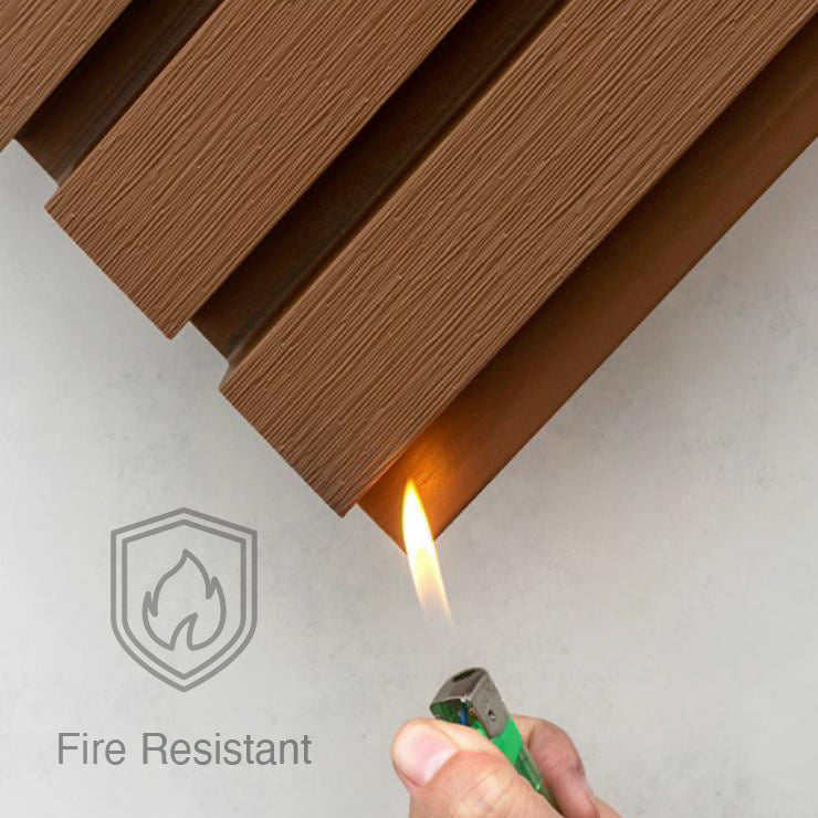 A flame flickers under Landmark Decors Teak Color Exterior WPC Panel, showcasing its fire-resistant durability. Ideal for outdoor spaces, this panel features a weather resistance icon, ensuring enduring protection against the elements.