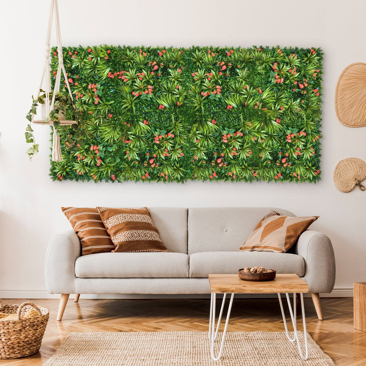 A cozy living room features a light gray sofa with patterned cushions. The Landmark Decors Tropical Floral Wall, brimming with red flowers and various plants, adds vibrancy to the space. A modern coffee table and woven baskets enhance the warm, natural ambiance.
