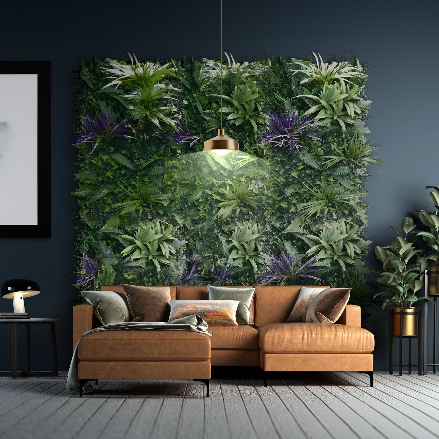 A stylish living room boasts a tan leather sectional with decorative pillows, a Landmark Decor Amethyst Zen Greenery vertical garden wall of lush foliage, a gold pendant light overhead, and an elegant side table lamp. A potted plant and vibrant purple flowers complete the space.