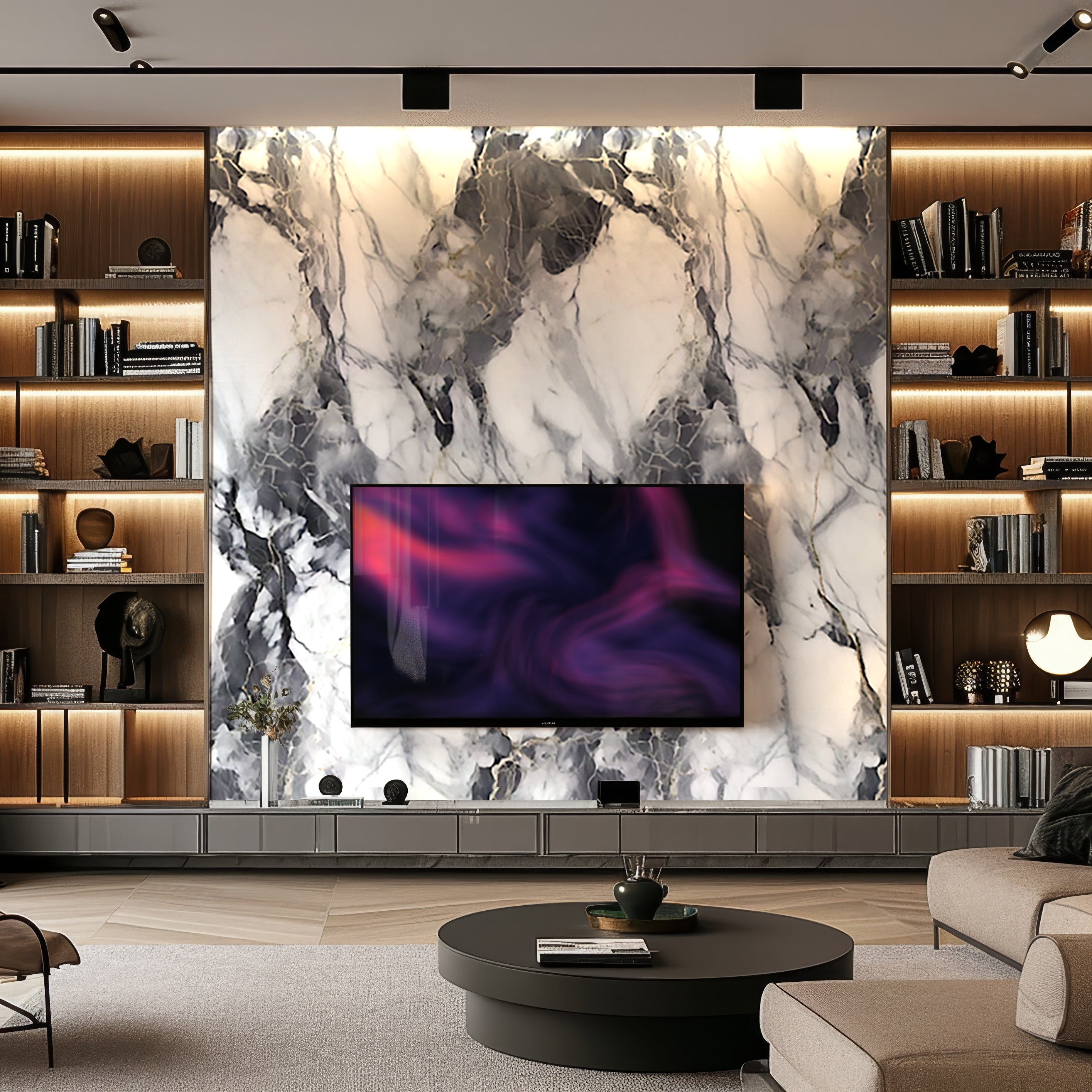 A modern living room showcases luxurious aesthetics with a large TV on Landmark Decors Monarch Contrast Marble Durable PVC Wall, surrounded by wooden shelves displaying books and decor. A round coffee table sits elegantly in the center.