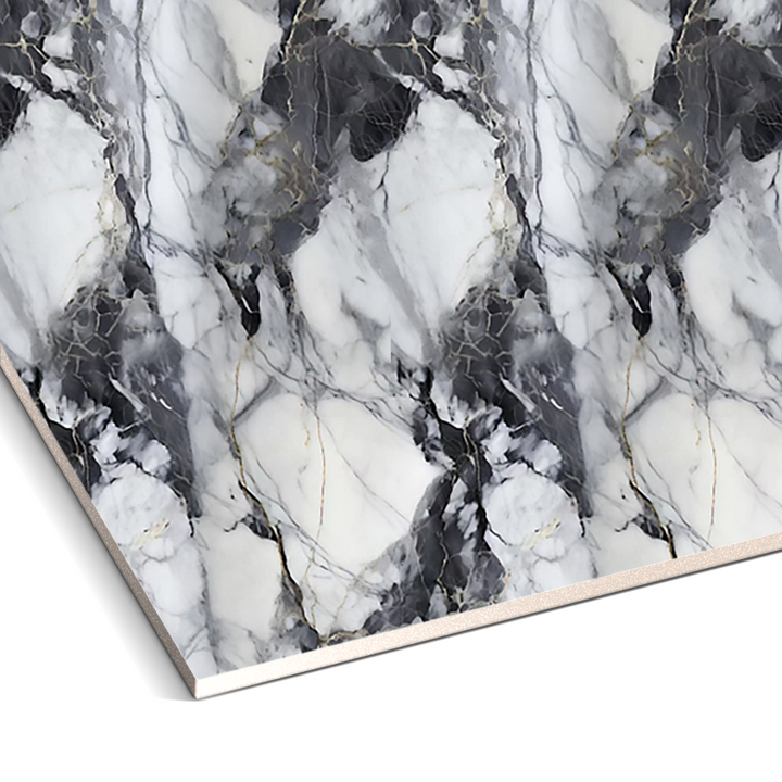 The Shadow Storm Marble Durable PVC Wall panels by Landmark Decor feature an abstract black and white pattern with gray veins, forming a symmetrical geometric design that adds luxurious aesthetics to interiors.