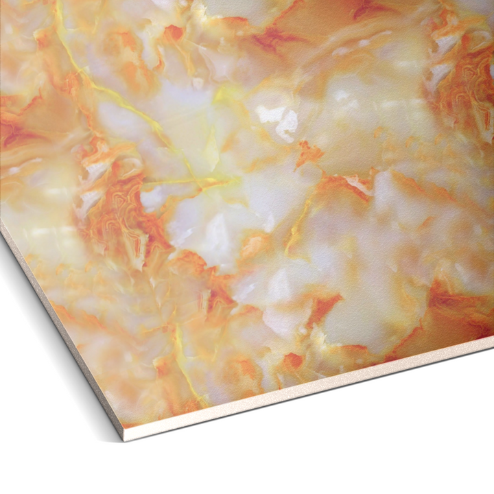 A close-up of the Landmark Decors Silver Frost Marble Durable PVC Wall reveals swirling patterns in warm cream, orange, and light yellow tones. Its intricate design emulates natural stone textures, perfect for a sophisticated sanctuary. The surface edge is visible in the lower left corner.