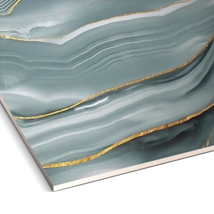 Featuring teal and white wavy patterns with gold accents, this abstract artwork harmonizes beautifully with the Serene Glacier Marble Durable PVC Wall by Landmark Decor, enhancing contemporary settings with a luxurious touch of sophistication.