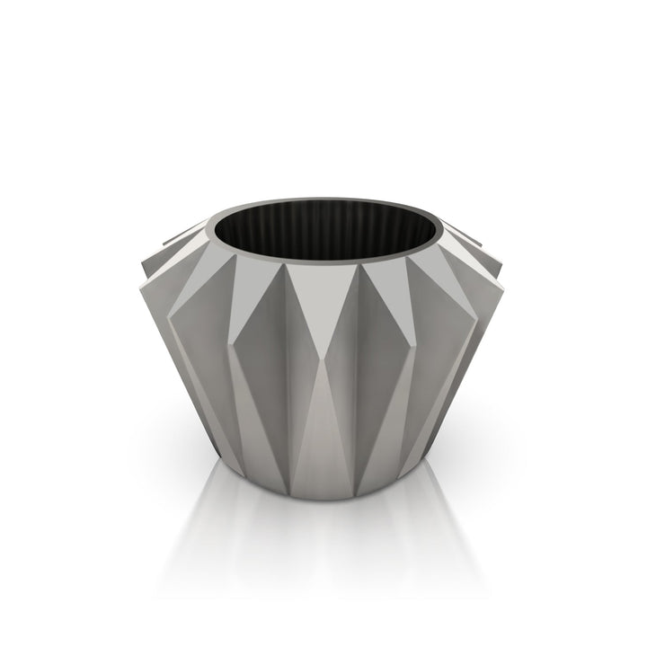 The Diamanta Elegant Planter by Landmark Decor features a geometric gray design with a faceted exterior and circular opening, adding luxury and nature to any space. Displayed on a white background, it captures the essence of handmade elegance.
