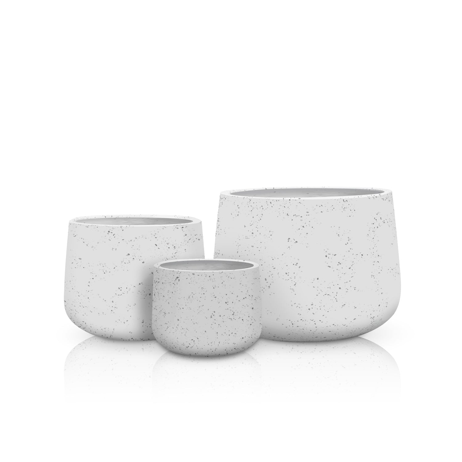 The Aura di Pietra Planter Full Set by Landmark Decor features three white, speckled planters of varying sizes with a minimalist modern design, arranged on a reflective surface to blend luxury and nature.