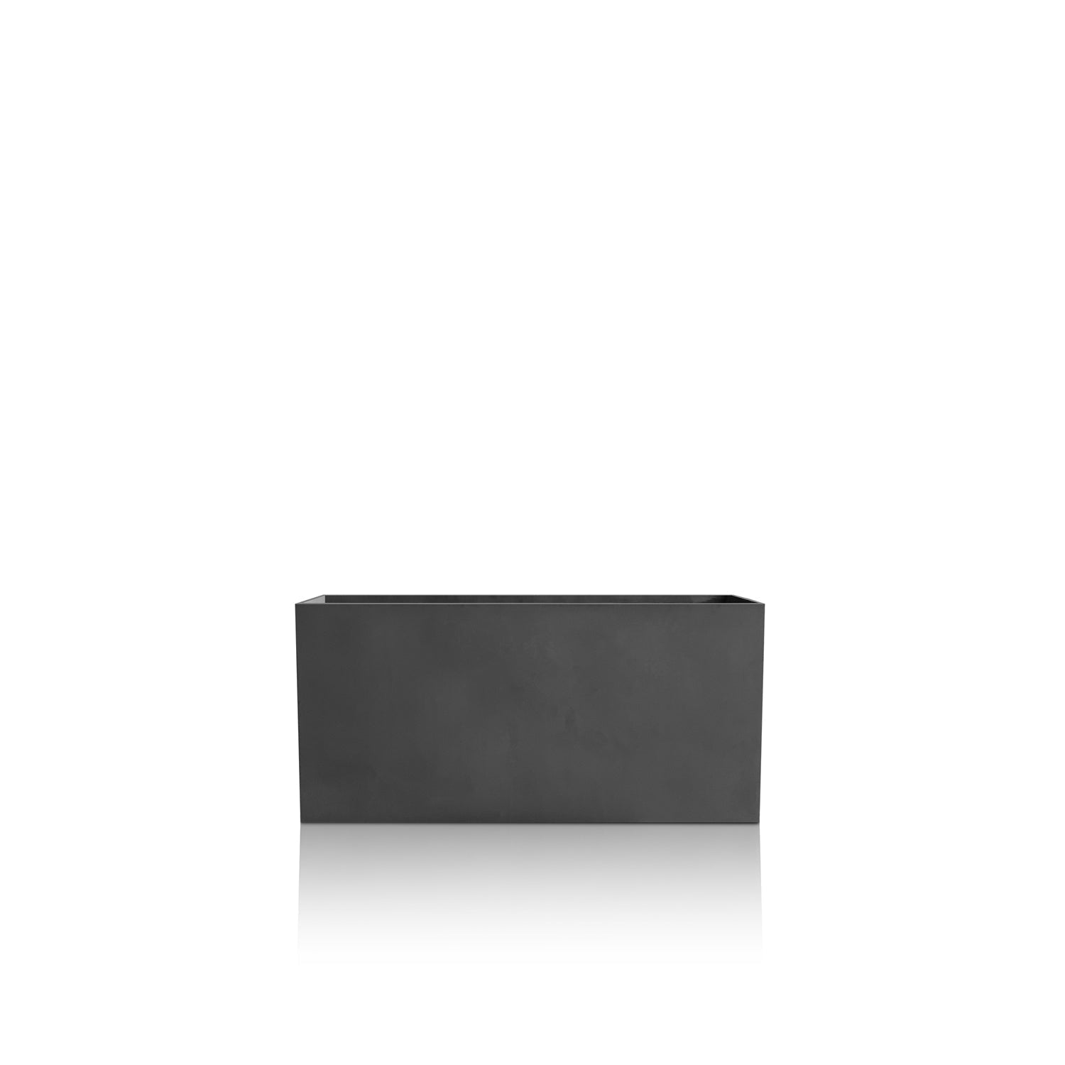 The Minimalist Oasis Planter - Small by Landmark Decor, a luxury handmade piece, stands out against a plain white backdrop. Its smooth, rectangular black design and subtle shadow elegantly celebrate nature.