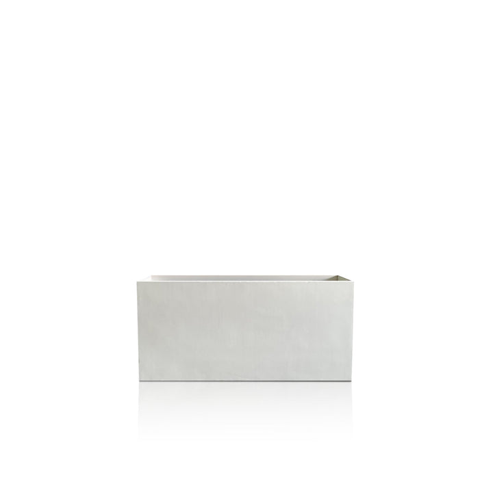 The Minimalist Oasis Planter - Small by Landmark Decor is a sleek rectangular silver planter box set against a white background. Its smooth, reflective surface embodies luxury and natures essence with refined elegance.