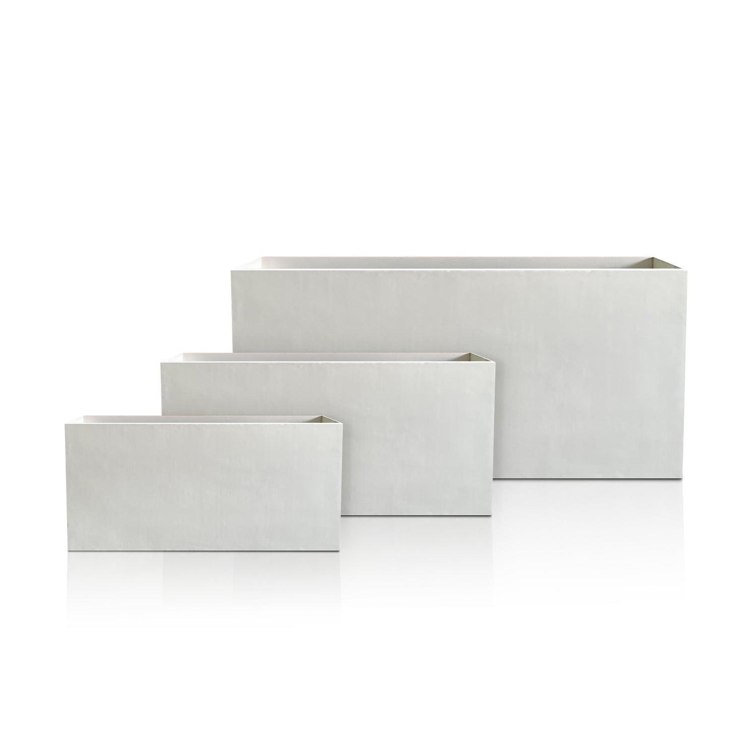 The Minimalist Oasis Planter - Full Set by Landmark Decor showcases three handmade rectangular planters of different sizes arranged in a row on a white backdrop, with the smallest upfront and largest behind, effortlessly blending luxury and nature.