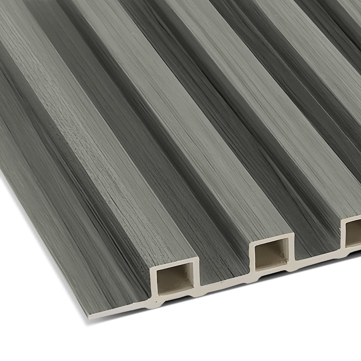 Close-up of the Light Gray WPC Fluted Slat Wall Panel by Landmark Decor, showcasing its gray, rectangular design with lengthwise ridges and visible hollow sections at the edges for a textured, lightweight appearance ideal for accent walls.