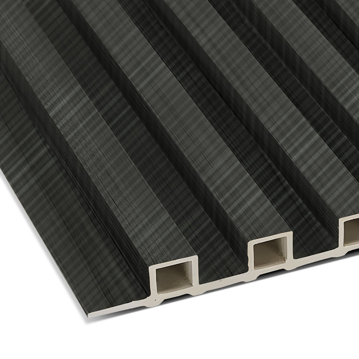 Close-up of Landmark Decors Carbon Black with Diagonal Texture WPC Fluted Slat Wall Panel, showcasing its dark green, wavy texture and rectangular hollow slots. The modern design is ideal for accent walls with its consistent pattern.